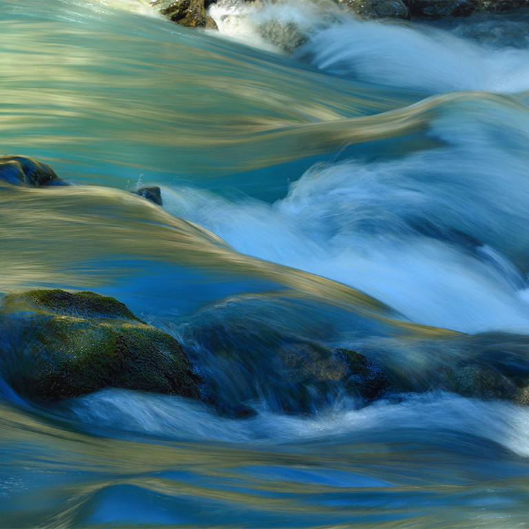 This is colorful stream in Caucasus river in morning